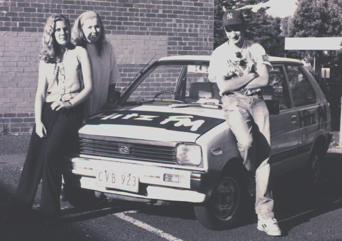 Image of Hitz FM cruiser with 3 volunteers. 3rd broadcast, February 1994.